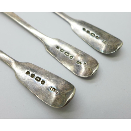 812 - Three Georgian silver spoons, a pair of silver sugar bows, two silver plated forks with mother of pe... 