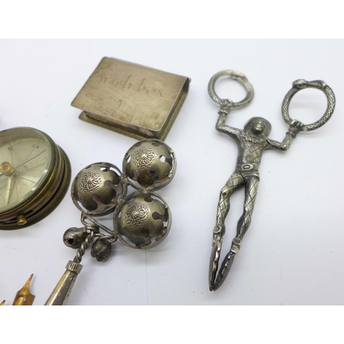 836 - A pair of novelty sugar nips, a rattle/whistle, compasses, etc.