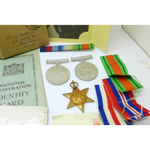 845 - A set of three WWII medals with box and papers, with some Royal Navy service papers