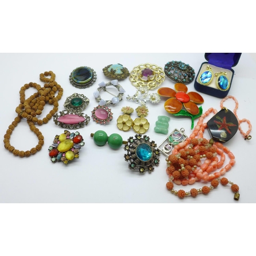 855 - A carved coral bead and pearl necklace, a coral necklace, lucite pendant, brooches, etc.