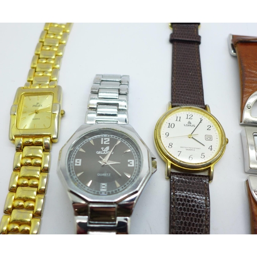 858 - A collection of lady's and gentleman's wristwatches including Timex, Lorus, a small trench style wat... 