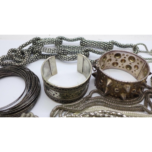 875 - Three cuff bangles, a bracelet and other jewellery