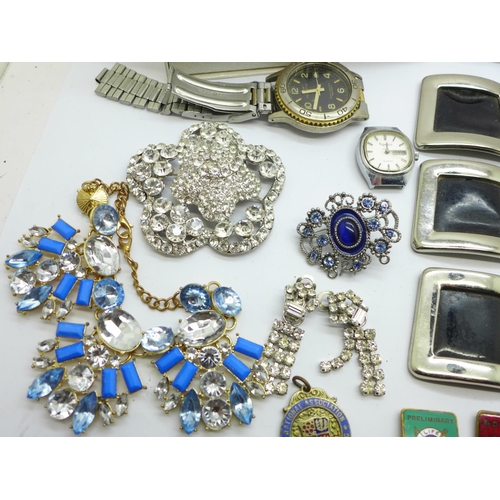 883 - A silver bracelet with enamel charms, costume jewellery and wristwatches