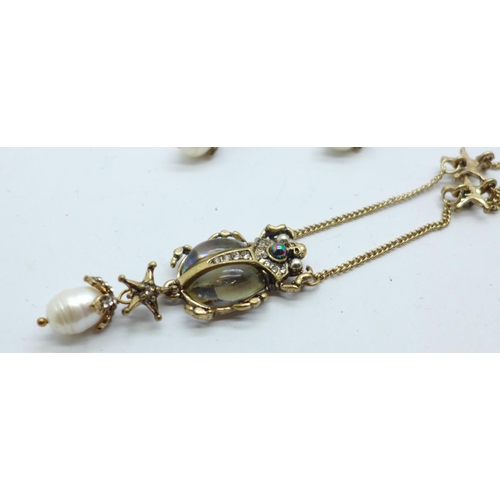 886 - A modern scarab beetle jewellery set, a bangle, pendant and chain and a pair of earrings, set with a... 