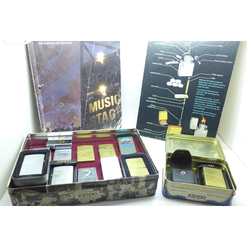 897 - A box of thirteen Zippo lighters, a Zippo shop display card and a catalogue