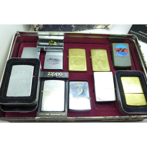 897 - A box of thirteen Zippo lighters, a Zippo shop display card and a catalogue