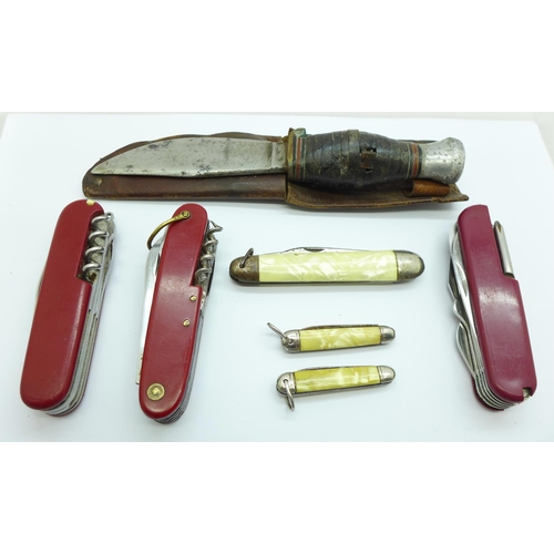 908 - Three Swiss Army knives, a WWII Army knife and three others