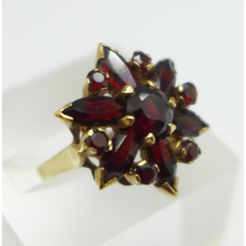 950 - A 9ct gold, garnet cluster ring, 4.8g, O