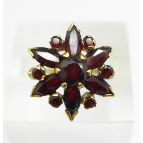 950 - A 9ct gold, garnet cluster ring, 4.8g, O