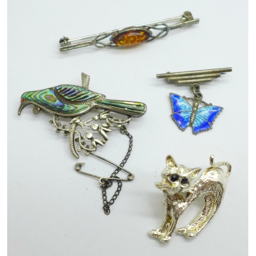 952 - Four silver brooches including an enamelled butterfly drop brooch