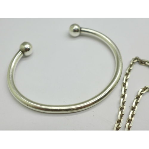 972 - A silver torq bangle and chain, 61g