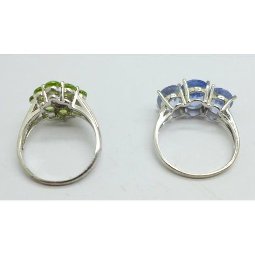 977 - A silver and blue stone ring and a silver and peridot ring