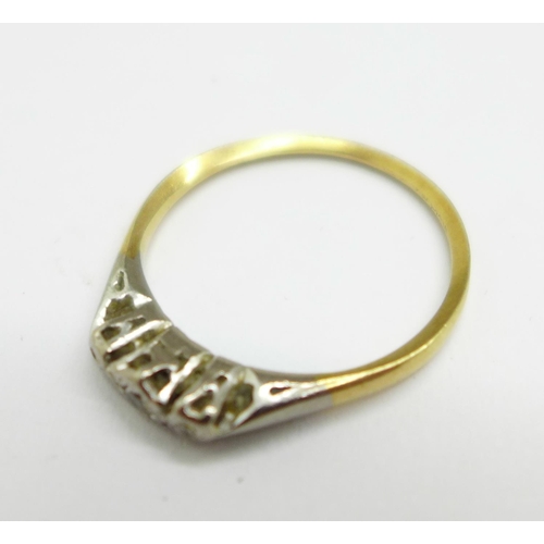 987 - A yellow and white metal set ring, lacking one small diamond, shank worn, 1.6g, N