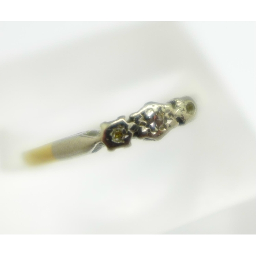 987 - A yellow and white metal set ring, lacking one small diamond, shank worn, 1.6g, N