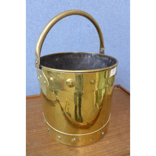 415 - An Arts and Crafts brass coal bucket