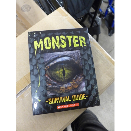 2306 - 6 Boxes of Monster Survival Guide Scholastic Books with holograph front - approx. 180 in total