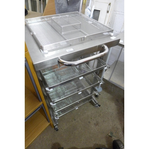 2399 - A mobile stainless steel top trolley with 4 wire shelves & 1 spare