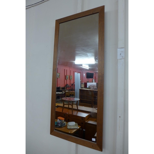 101 - Two teak framed mirrors and a pine framed mirror