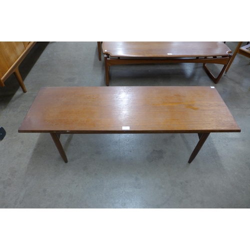 106 - A teak coffee table