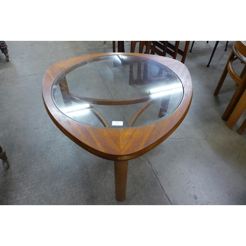 125 - A Nathan teak and glass topped triangular coffee table