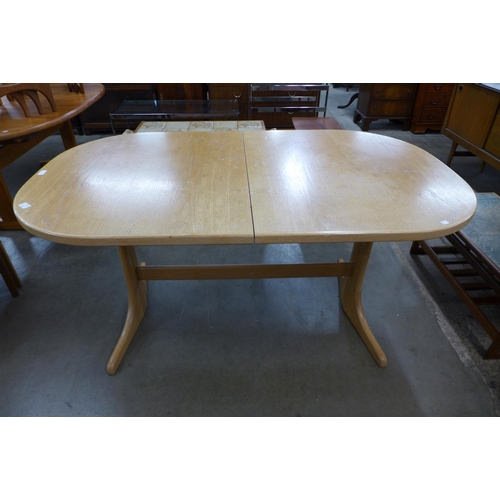 126 - A McIntosh teak extending dining table