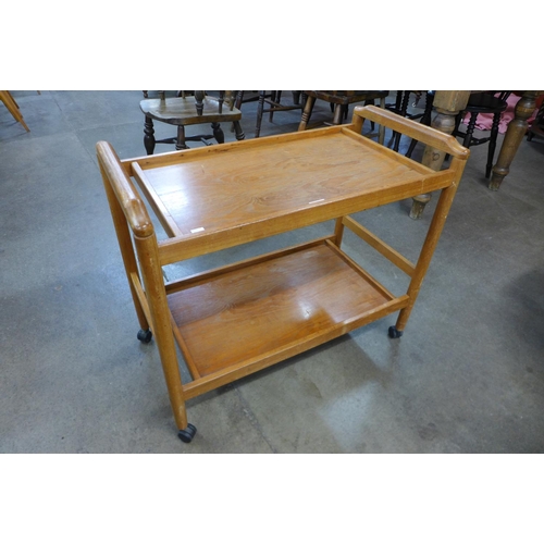 128 - A teak trolley