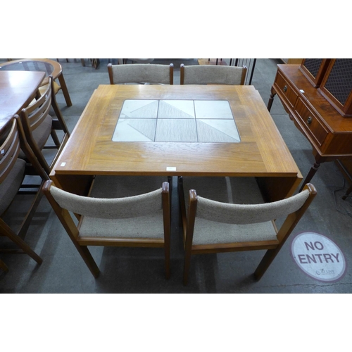 145 - A Danish Gangso Mobler teak and tiled top drop leaf dining table and four chairs