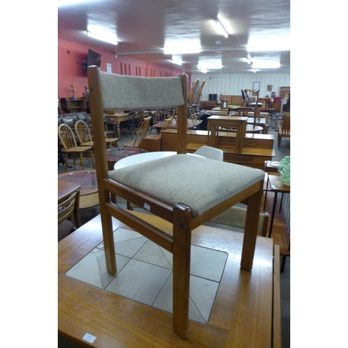 145 - A Danish Gangso Mobler teak and tiled top drop leaf dining table and four chairs