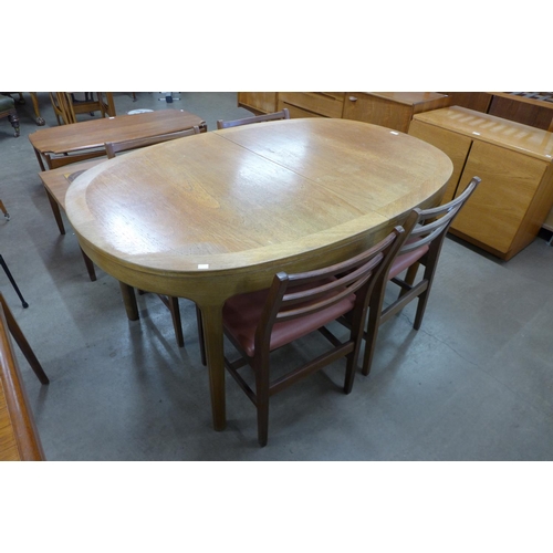 165 - A Nathan teak dining table and four chairs