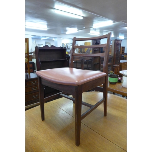 165 - A Nathan teak dining table and four chairs