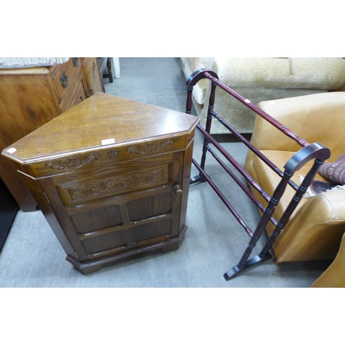 226 - An oak corner cabinet and a towel rail