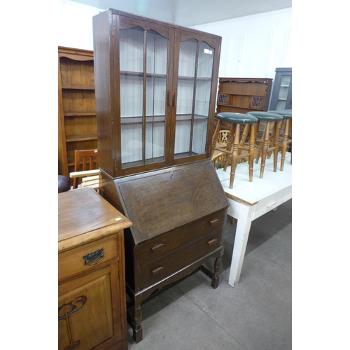 229 - An oak bureau bookcase