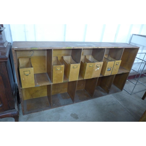 232 - An oak office pigeon hole cabinet with seven filing trays