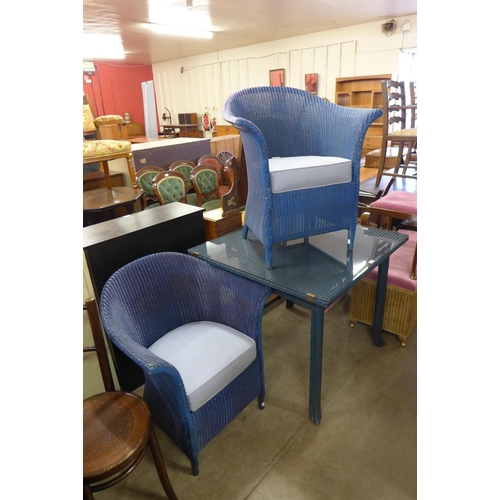 252 - A Lloyd Loom blue wicker table and two chairs