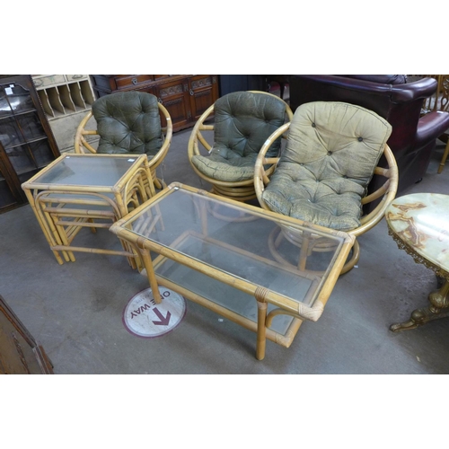 269 - A set of three bamboo swivel chairs by Angraves Invincible, Thurmaston, Leicester, a coffee table an... 