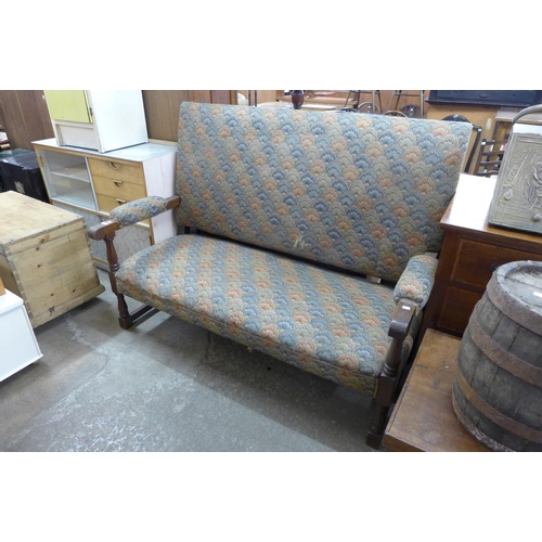 278 - A 1930's oak and upholstered settle