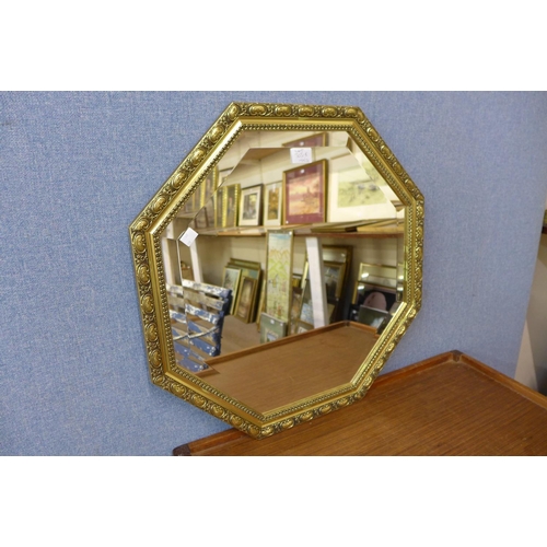 303b - A gilt octagonal framed mirror