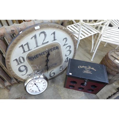 318 - Two contemporary wall clocks and a wine rack