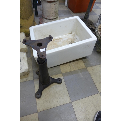 320 - A Singer cast iron stool base, a/f and a Belfast sink