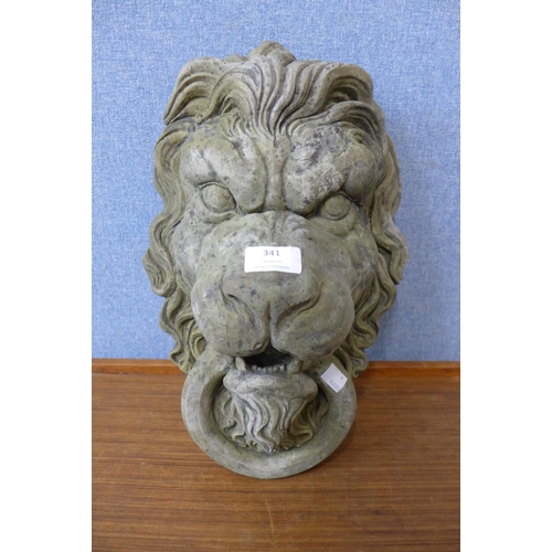 341 - A concrete lion's head garden wall mask