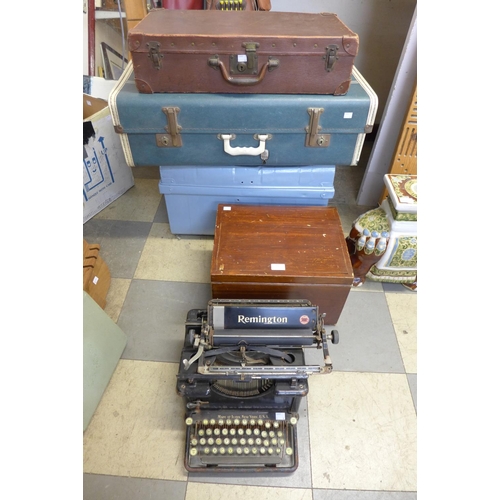 392 - A vintage Remington typewriter, two cases and a wooden box