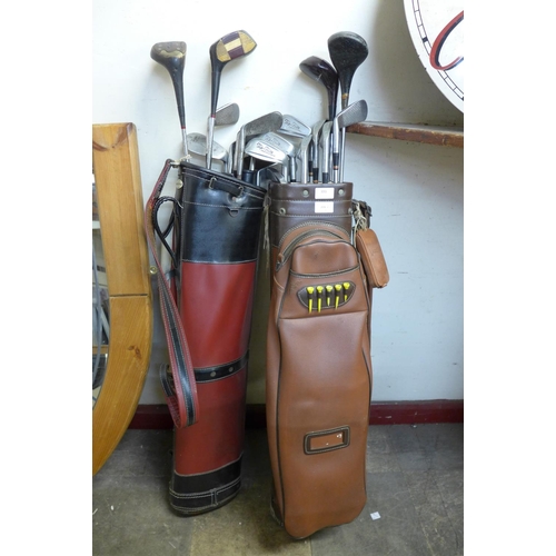 393 - Two sets of vintage Spalding golf clubs, with bags