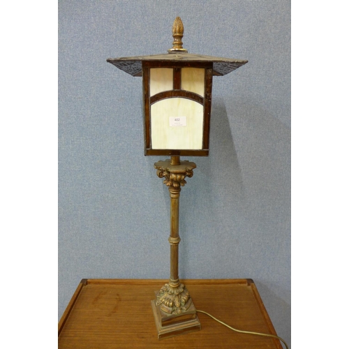 402 - A gilt metal lantern style table lamp