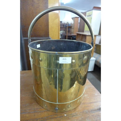 415 - An Arts and Crafts brass coal bucket