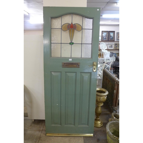 417 - A painted pine and stained glass door