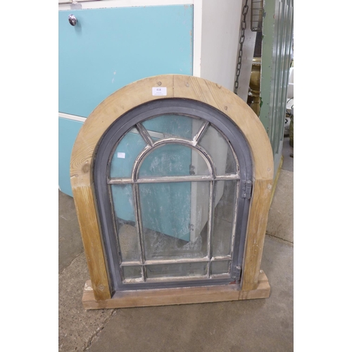 418 - An arched pine framed window