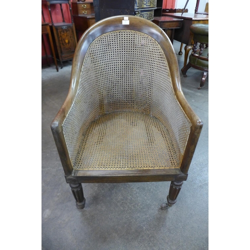 72 - A George IV rosewood bergere library armchair