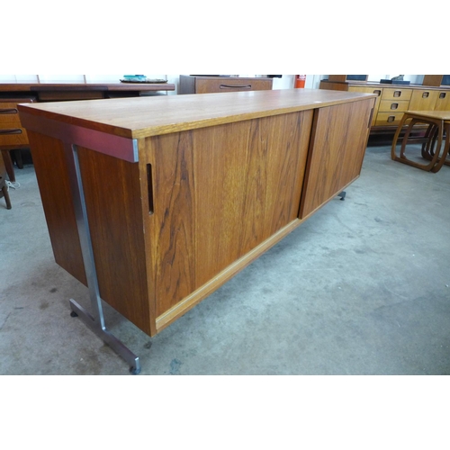 89 - A teak and chrome ended sideboard