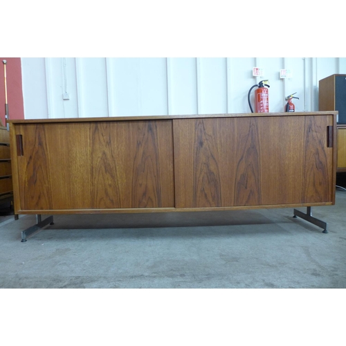 89 - A teak and chrome ended sideboard