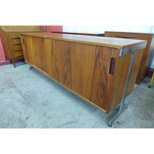 89 - A teak and chrome ended sideboard